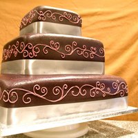 Purple Fondant Square cake with dark purple fondant and light purple pipping. I tried to make my picture super cool with background, but the sheet just...