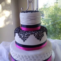 Wedding Cakes Fuschia and Black wedding with silver accents.
