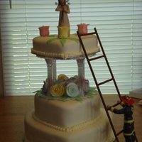 Fireman Wedding Cake This is a double layered 3 tier red velvet wedding cake with handmade fondant flowers, leaves, as well as fondant clothing on the fireman....
