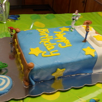 Toy Story Cake Toy story bed cake, characters are not edible due to lack of time! Strawberry cake with buttercream icing covered in marshmallow fondant!