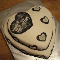 Anniversary Heart Cake vanilla pound cake with buttercream and marshmallow icing. Also topped off with edible glitter dust!