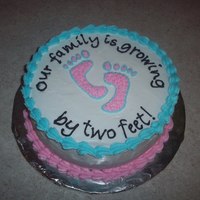 Our Family Is Growing... 8" round cake with buttercream frosting. Announcing the arrival of a little one...
