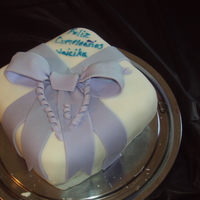 Present yellow cake with fondant decorations