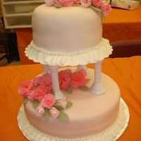 Wilton Course 3 Final Cake My first 2 tiered cake. My fondant I layered my cakes with was too thin so I had some bulging around the sides but did not try to fix it...