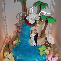 Beach Theme Wedding Cake First wedding cake done outside of a Wilton class. Flowers are gumpaste, palm tree, coconuts and leaves are 50/50, monkey is fondant, sand...