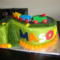#2 Train Almond cake with cheesecake buttercream and fondant accents. Toy Train.
