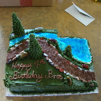 Mountain Biking Child's 4th birthday. He loved mountain biking. Mom was going to add toy bikes to cake when she got it home. Sugar cone trees,...