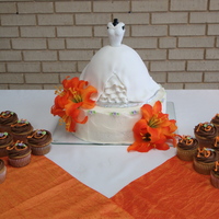 Bridal Dress W/cupcakes Bridal Dress - almond cake with cheesecake buttercream. The orange orchids are silk flowers. My first attempt at the 'dress cake'...