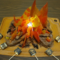 Campfire Cake This cake was made for my son's cub scout troop. I melted red, yellow, and orange jolly ranchers on a cookie sheet. After they cooled...
