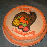 Thanksgiving Cornucopia A Pumpkin cake with cream cheese buttercream icing and a frozen buttercream transfer