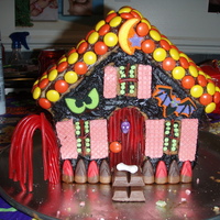 My Haunted Mansion This is a confetti cake, made into a Halloween Spooky House. I used Reeses Pieces for the roof, wafer cookies for the shutters, twizzlers...