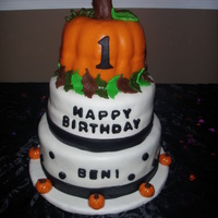 "first Cake" I made this cake for my son's first birthday party. The cake was covered in MMF. The bottom and middle tiers were french vanilla with...