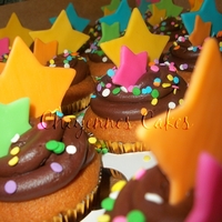Stars Stars Stars yellow cake wit chocolate frosting. Modeling chocolate stars and candy confetti.