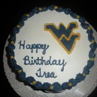 West Virginia Birthday Cake 8 inch round chocolate cake with buttercream - buttercream decorations & modeling chocolate footballs.