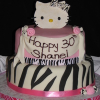 Hello Kitty Couture Fondant cake with fondant/gumpaste accents. Rolled pink and zebra print roses. Hello Kitty gumpaste topper (head and bow) cut and painted...