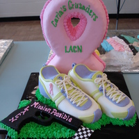 Lacn This is the cake I made for the local area Cancer Walk. The ribbon is made out of Rice Krispie treats and the rest is carved with...