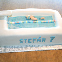 Swimmer Birthday Cake This was a birthday cake for a 7 year little swimmer :0) Chocolate cake with mm fondant.