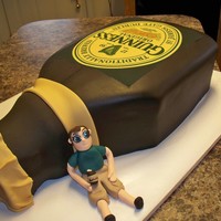 Guiness Cake For Groom guiness cake, made with 3 sheet cakes stacked and carved with rice krispy treat top part molded, 50 50 gumpaste fondant man to match...