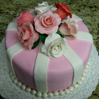 Roses And Stripes Gum paste roses and fondant. Chocolate cake with vanilla buttercream icing.