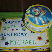 Toy Story Cake This is Toy Story Cake. Chocolate cake covered in buttercream with MMF stars. Also decorated with Toy Story figurines.