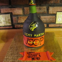 Remy Martin Cake vanilla pound cake and buttercream icing, top is rice krispies... all covered in Black/Vanilla Satin Ice Fondant