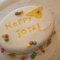 Cocktail Time! 2 layer oval cake covered in white fondant. All decorations, and accents, are also make of fondant with white sugar sparkles.