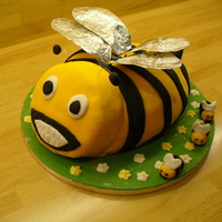 Bee Bee cake all in fondant apart from shop bought flowers. Wings in foil covered with sparkly flakes