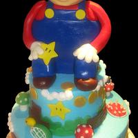 Mario Cake 6" and 10" chocolate cake iced w/buttercream, fondant decorations..Mario sculpted from Rice krispies,,first time doing that!...