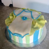 Baby Onesie Gift Cake I was stupid and didn't take any better pictures of this cake. 8" yellow cake with fondant decorations. Onesie cut out of fondant...