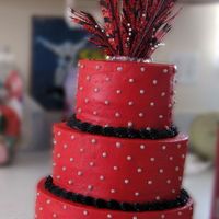 Red Feathers Wedding Shower Customer wanted this design with a feather topper, not my favorite design but it's what they wanted. 3 tier - 10, 8, 6" iced in...