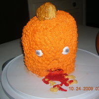 Jack O' Savage I wanted an original idea so I came up with a savage man eating pumpkin. This is a low fat banana cake. The frosting is all whipped cream...