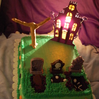 Halloween Manor cemetary with haunted house