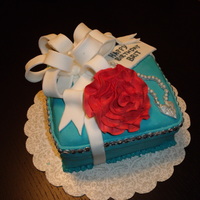 Tiffany Birthday Cake 3 layer, white velvet cake with vanilla raspberry filling covered in fondant and fondant decorations. the rose is gumpaste. this cake...