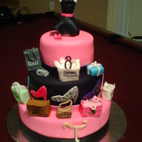 Shopping Diva cake for a shopping diva. bags and dress form are fondant covered RKT. I had a lot of fun with this one