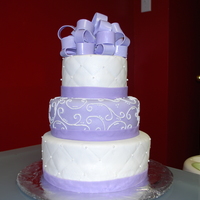 50Th Bday The lady who wanted this cake requested it look just like the wedding cake I did only purple and with the bow.
