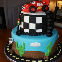Cars Cake Cars cake for a three year old. WASC with strawberry jam filling, covered in buttercream then fondant. All accents are fondant or royal...