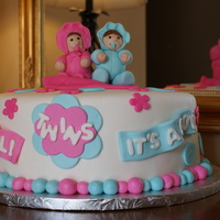 Twins! This was a cake I made for a shower for twins. Babies were 50/50 fondant/gumpaste, cake was WASC covered with vanilla butter cream then MMF...