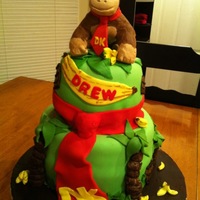 Donkey Kong This is a Donkey Kong cake made for a 4 year old. Donkey Kong is made from RKT covered in fondant. All accents are 50/50 fondant/gumpaste....