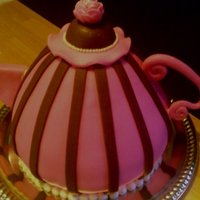 Tea Pot Cake... Made this for a friend's bday/church tea party...it's a spice cake baked in the Wilton Wonder Mold and then rice crispy treats...