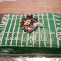 Baltimore Ravens Football Cake My sister and I made this cake for a friend for a football party. 3 thin layers of yellow cake with chocolate icing under fondant.
