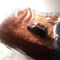 My Hubby's Bday Cake My hubby likes to drive on the beach in our Green Jeep. So I found a toy Jeep and painted it green to match ours lol.