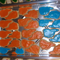 Baseball Caps these arent detailed, but it was part of my first attempt at making decorated cookies. blue and orange b/c my husbands a mets fan