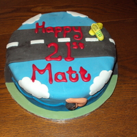 Triathlon Cake A fruit cake with marzipan and fondant on top. The shoes and bike were made from fondant modelling paste.