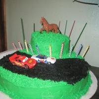 Birthday Cake- Racecar/ Horses This was the first cake I have ever made looking proffessional not just for a fathers day or mothers day present and I think I did pretty...