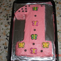 1St Birthday This is taken from the Australian Womens weekly, childrens birthday cake book. I adapted it by adding butterflies and choc chips.