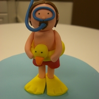 Snorkling This topper was for my one of my co-workers birthday cake. He is an avid snorkler. I added the duck float around his middle for fun!