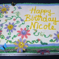 Spring Garden Flowery Birthday Cake complete with little "critters". BC Ice, Fondant accents.