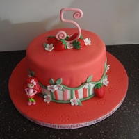 Strawberry Shortcake For my niece's 5th birthday. The 5 is made of gumpaste, all other decorations are fondant. Strawberry Shortcake is a plastic toy.