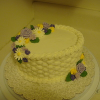 Wilton Course 2 This was from the old Wilton Course 2. Buttercream icing with royal icing flowers.