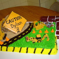 Construction Site This cake took forever. Used the Wilton doll pan for the sand hill. The sand is brown sugar. 1/2 sheet cake and then some more for the...